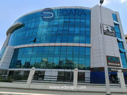 Modern commercial building with large glass windows and signage for EGBANK and Edara Property Services.