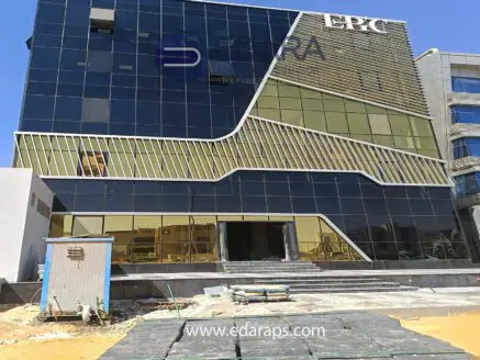 Modern commercial building with reflective glass facade and unique architectural design in Cairo.
