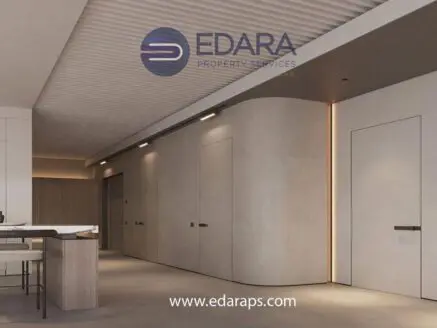 Contemporary hallway with smooth walls, recessed lighting, and minimalist doors in a modern interior setting.