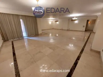 Large room featuring marble flooring and neutral-colored walls, suitable for various layouts.