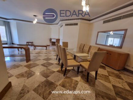 Dining area with glass table and upholstered chairs - Edara Property Services
