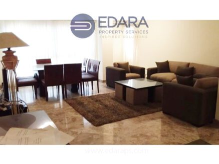 Elegant living and dining area with marble flooring and neutral furniture - Edara Property Services