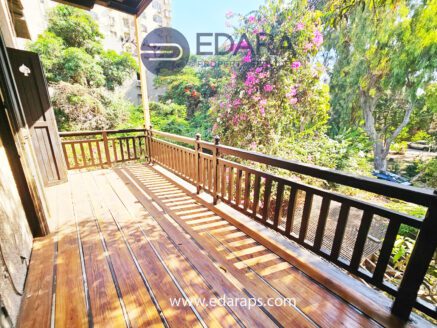 Balcony with wooden flooring and garden view – Edara Property Services