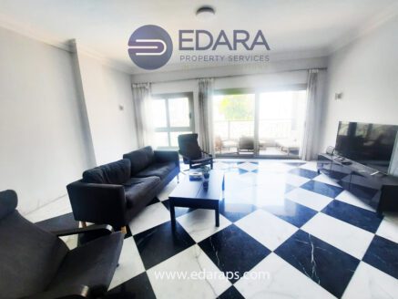 Living room with modern seating and marble floor – Edara Property Services