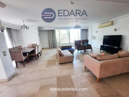 Spacious living room with sofas and TV – Edara Property Services